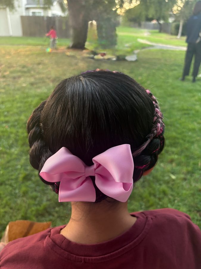 Braided bun with pink bow