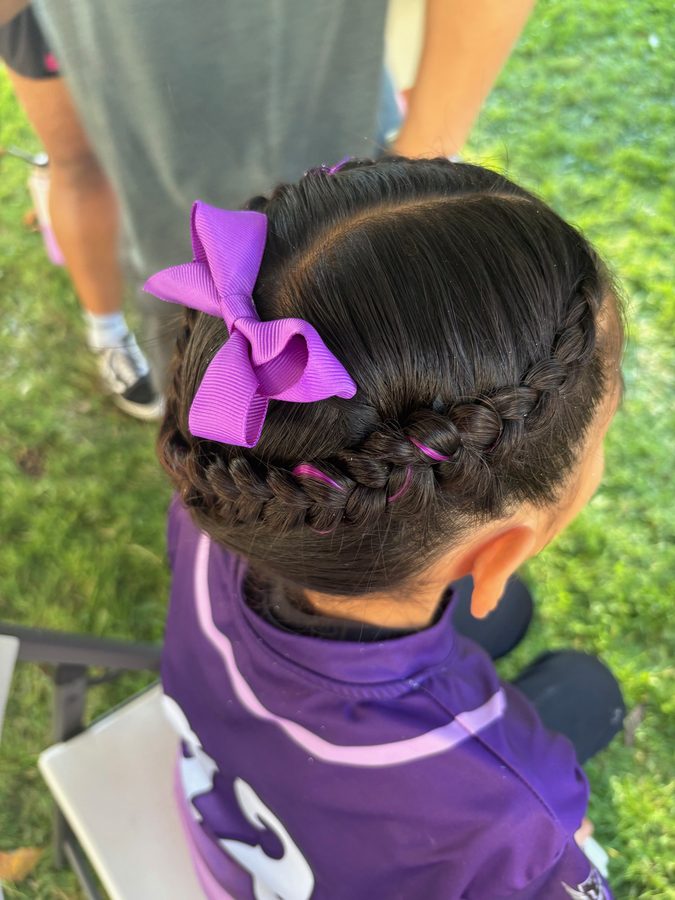 Braided crown with purple bow